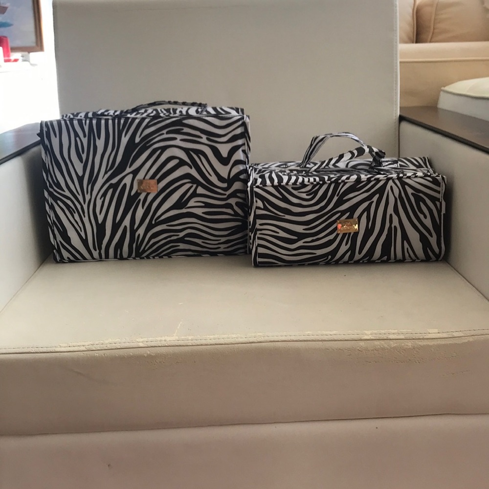 Two cosmetic or bathroom carrying bags in zebra-personal use or traveling!